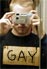Hurr hurr, he has a sign that done say gay onnit.