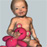 A CGI rendering of a baby girl with a Teddy Bear. Horrifying...